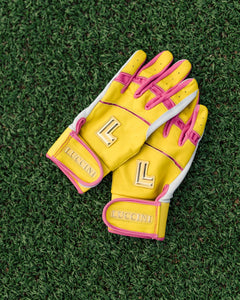 Yellow and pink gloves with 'Lucchini' branding on a grass background