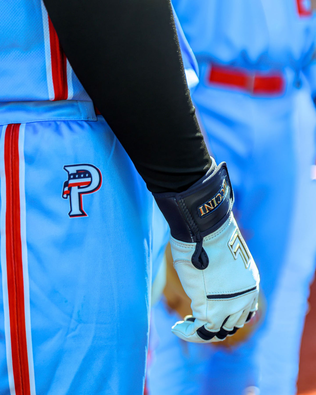 Luccini Navy Blue Gloves close up image on USA Prime Baseball Player